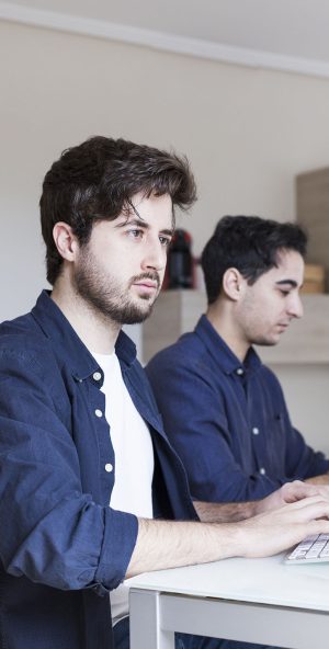 focused-men-using-computers